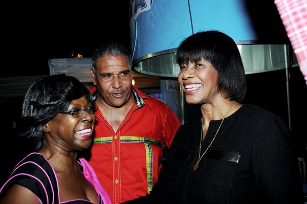 Winston Sill / Freelance Photographer
Heart Foundation of Jamaica  (HFJ) annual Wine and Food Festival, dubbed "Simply red and Wine Festival, held at Jamaica House Lawns on Friday night September 28, 2012. Hereare Lorna Golding (left); Saleem Lazarus (centre) and Prime Minister Portia Simpson-Miller (right).