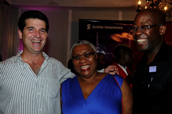 Winston Sill / Freelance Photographer
Heart Foundation of Jamaica  (HFJ) annual Wine and Food Festival, dubbed "Simply red and Wine Festival, held at Jamaica House Lawns on Friday night September 28, 2012. Here are William Mahfood (left); Marva Bernard (centre); and Hugh Reid (right).