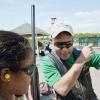 Rudolph Brown/Photographer
Joey Chin giving his daughter Jolie Chin a shooting tip at his target at Bernard Cridland Memorial Sporting Clay Shooting competition at the Jamaica Skeet Club on Sunday, October 27, 2013
