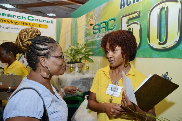 Rudolph Brown/ Photographer
Michelle Morris, (right) Communications Officer of Scientific Research Council chat with Marlene Simpson at the JBDC Small Business Expo at Jamaica Pegasus Hotel in New Kingston on Tuesday, May 21, 2013