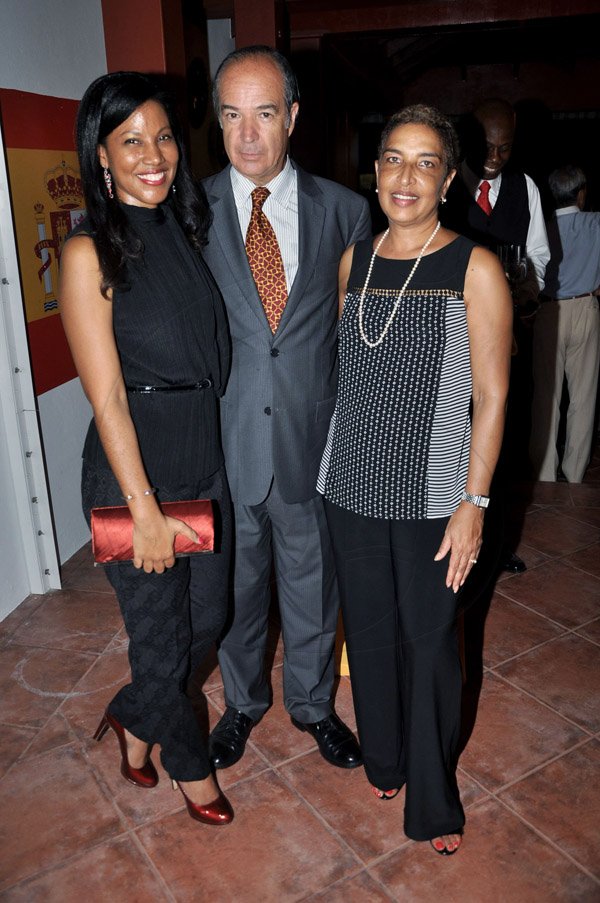 Jermaine Barnaby/Photographer
Sandwiched by the lovely Nicola Madden- Greig (left) and the elegant Avril Norton, property manager Courtleigh Corporate center (right) is Chilean Ambassador to Jamaica Eduardo Bonilla 

Spain's National Day at the Embassy Residence – I-B Norbrook Road on Thursday, October 9, 2014.