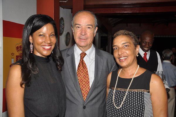 Jermaine Barnaby/Photographer
From left Nicola Madden- Grig, Chilean Ambassador to Jamaica Eduardo Bonilla and Avril Norton, proprty manager Courtleigh Corporate center at Spain's National Day at the Embassy Residence – I-B Norbrook Road on Thursday, October 9, 2014.