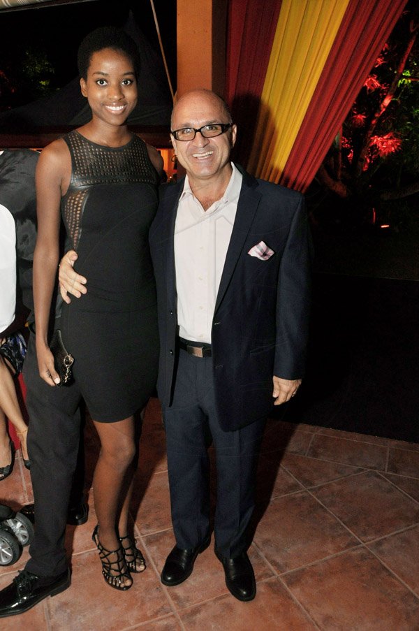 Jermaine Barnaby/Photographer
Dimitris Kosvogiannis (left) and his guest Jenaae Jackson coordinate in classic black attire

Spain's National Day at the Embassy Residence – I-B Norbrook Road on Thursday, October 9, 2014.