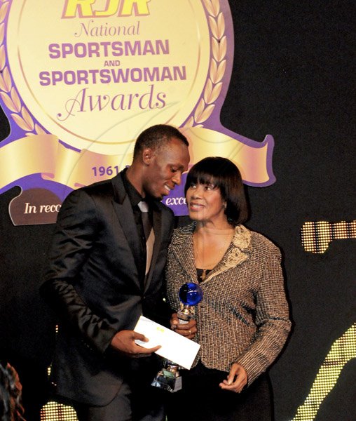 Winston Sill / Freelance Photographer
Prime Minister Portia Simpson Miller (right) shares a joke with Usain Bolt during the RJR National Sportsman and Sportswoman Award Ceremony, held at the Jamaica Pegasus Hotel on Friday.