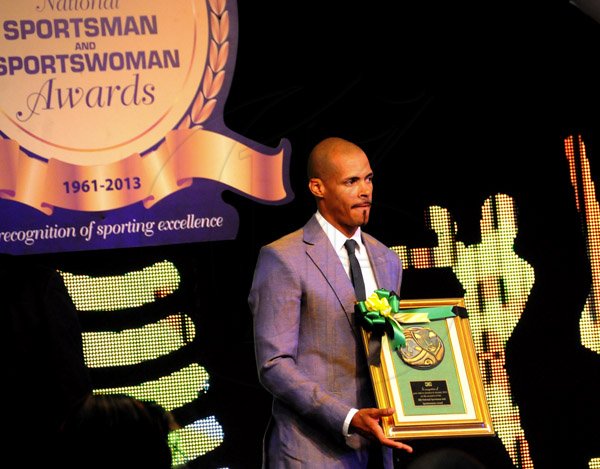 Winston Sill / Freelance Photographer
Olympic 400m hurdles champion poses with a plaque at Friday night's RJR National Sportsman and Sportswoman Award Ceremony, held at the Jamaica Pegasus Hotel. Sanchez was a special guest at the function.