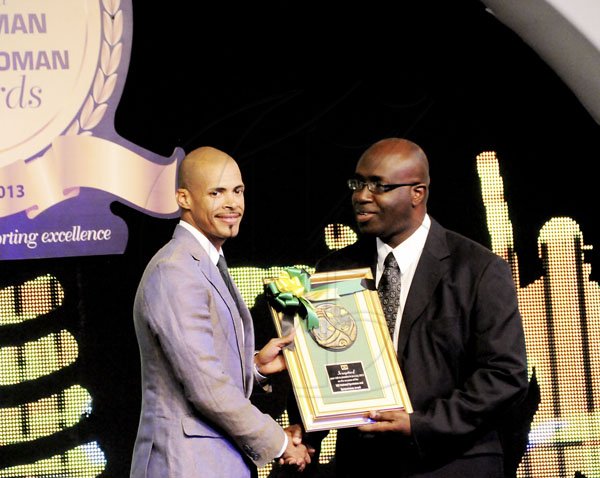 Winston Sill / Freelance Photographer
Olympic 400m hurdles gold medalist Felix Sanchez (left), a special guest at Friday night's RJR National Sportsman and Sportswoman Award Ceremony at the Jamaica Pegasus, receives a plaque from RJR's Group Managing Director Gary Allen.l

RJR National Sportsman and Sportswoman Award Ceremony, held at the Jamaica Pegasus Hotel, New Kingston on Friday night January 11, 2013.