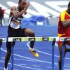 Ian Allen/Photographer
Yanick Hart of Wolmers and Tyler Mason of Jamaica College went to the the line in the Class 1 Boys 110 metre hurdles semi-finals at the Bos and Girls 2013 Atlethics Championships.