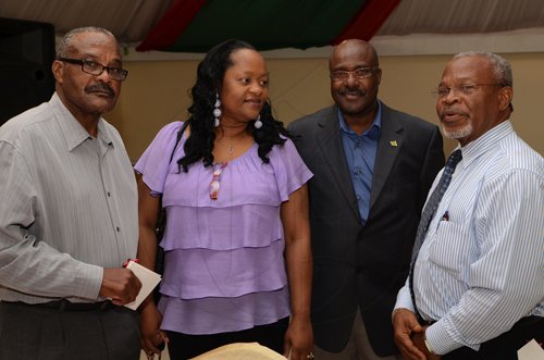 Contributed
Sandra Thompson, (second left) General Manager chat with fom left Herman Chambers, Winston Fletcher, president and Silvera Castro at the St. Catherine Co-operative Credit Union awards luncheon at the Terra Nova Hotel recently