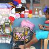 Jermaine Barnaby/Photographer
A woman seen knitting crochet outside a store along Main Street in St Ann's Bay during a tour of parish capital, St Ann's Bay on Saturday March 21, 2014.