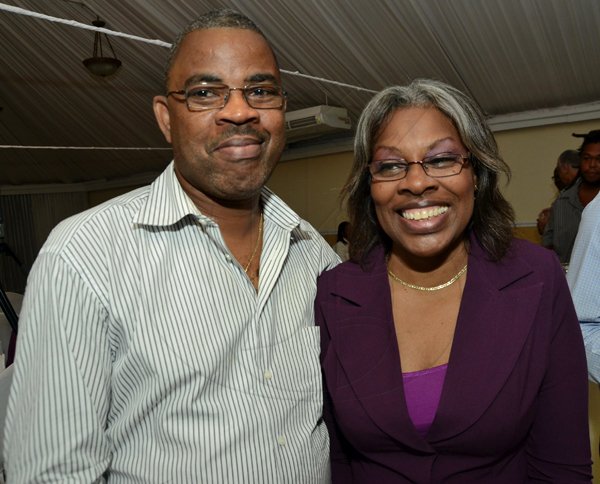 Rudolph Brown/Photographer
Wayne Hardie, Financial Controller of Globe Insurance Pamela Lewis, manager of client services for  Sterling Asset Management  at the Sterling Asset Management Investor Briefing at the Terra Nova Hotel in Kingston on Thursday, September 27-2012
