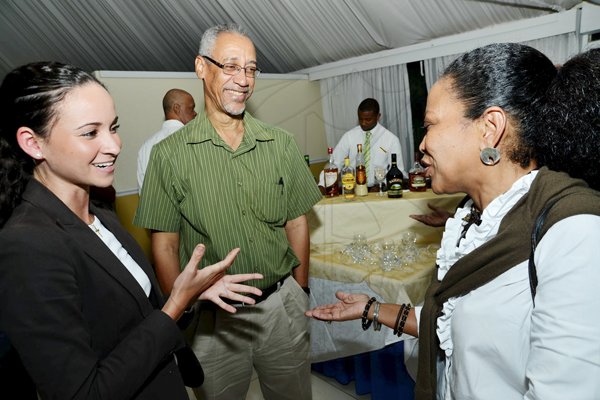 BUSINESS

Rudolph Brown/Photographer
Sterlings Marian Ross (left) engages Andrey Welds and her husband Dennis Welds at the Sterling Asset Management Investor Briefing at the Terra Nova hotel in Kingston on Thursday, September 27, 2012.