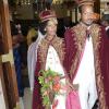 Rudolph Brown/Photographer
Steven Golding son of Prime Minister Bruce Golding and his bride Emprezz, exit the University Chapel dressed in traditional African royal robes, after their wedding ceremony yesterday.