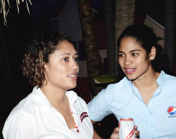 Winston Sill/Freelance Photographer
Summerfest Productions Limited host Reggae Sumfest 2014  Launch, held at Countryside Club, Courtney Walsh Drive on Tuesday night June 10, 2014. Here are Erin Mitchell (left), Red Stripe Brand Manager; and Catherine Goodhall (right), Regional Brand Manager, Pepsi.