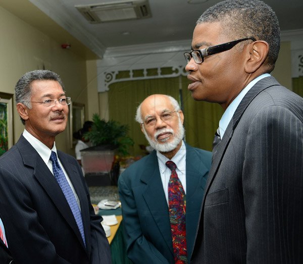 Rudolph Brown/Photographer
Business Desk
Peter Chin, (left) chat with Directors of Supreme Ventures Dr David McBean, (right) and James Morrison at the Supreme Ventures Ltd AGM at Knutsford Court Hotel in Kingston on Monday, June 3, 2013