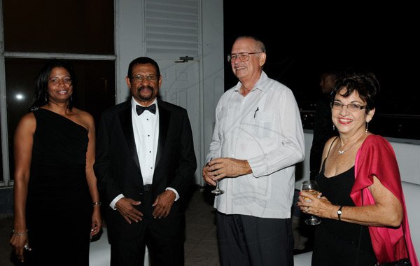 Winston Sill/Freelance Photographer
The Association of Surgeons in Jamaica (ASJ) Annual Awards Banquet, held at the Jamaica Pegasus Hotel, New Kingston on Saturday night May 18, 2013. Here are Donna McCartney (left); Dr. Trevor McCartney (second left), awardee; Prof. Peter Fletcher (second right); and Margaret Fletcher (right).