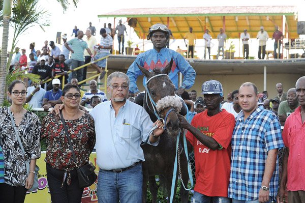 Ian Allen/Photographer
Handlers of Future King in the Winners Enclosure at Caymanas Park after Future King won the 104th Running of the Supreme Ventures Jamaica 2-Y-O Stakes Trophy over 1600 metrees on Saturday.
