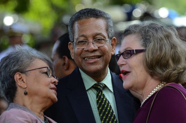 Rudolph Brown/Photographer
Professor Denise Eldemire-Shearer, (right) chad with Deputy Prime Minister and Minister of Foreign Affairs and Foreign Trade, Dr. Ken Baugh and his wife Vilma Baugh at Andrew Holness swearing in as new Prime Minister at King's House on Sunday, October 23-2011