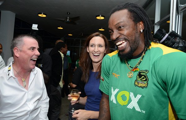 Rudolph Brown/ Photographer
Locky Mulholland,(left) Co-founder and Managing Director of XOX brand, share a joke with Melanie Subratie, Director of Facey Commodity and Chris Gayle, international cricketer at a welcome reception on Wednesday night hosted by XOX for members of the Jamaica Tallawahs cricket team at the Pegasus Hotel.