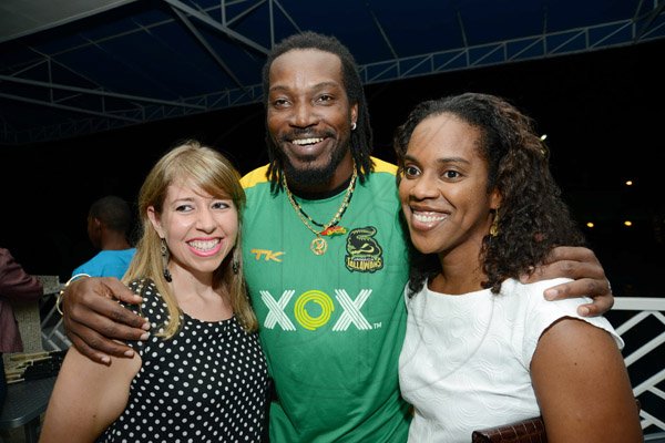Rudolph Brown/ Photographer
Chris Gayle pose with Kathryn Silvera, (left)  and Tamii Brown at a welcome reception on Wednesday night hosted by XOX for members of the Jamaica Tallawahs cricket team at the Pegasus Hotel.