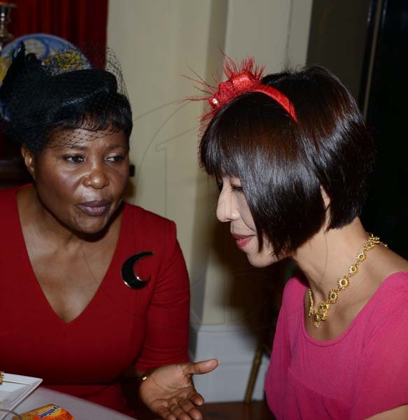 Winston Sill/Freelance Photographer
Dress for Success Jamaica annual Fundraising Tea Party, held at the British High Commission, Trafalgar Road on Thursday night November 7, 2013. Here are Lady Patricia Allen (left); and Hisae Fitton (right), wife of the British High Commissioner.