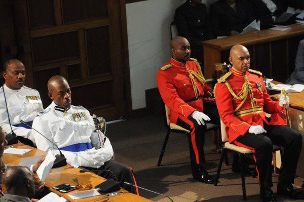 Jermaine Barnaby/Freelance Photographer
Police commissioner Dr. Carl Williams (left) and Brigadier Antony Anderson Chief of Defence Staff of the Jamaica Defence Force at the state opening of Parliament at Gordon House on Thursday April 14, 2016.