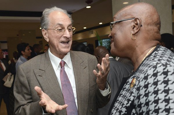 Rudolph Brown/ Photographer
John Issa (left) has the full attention of Audrey Hinchcliffe at the cocktail reception of the The Gleaner's Honour awards.