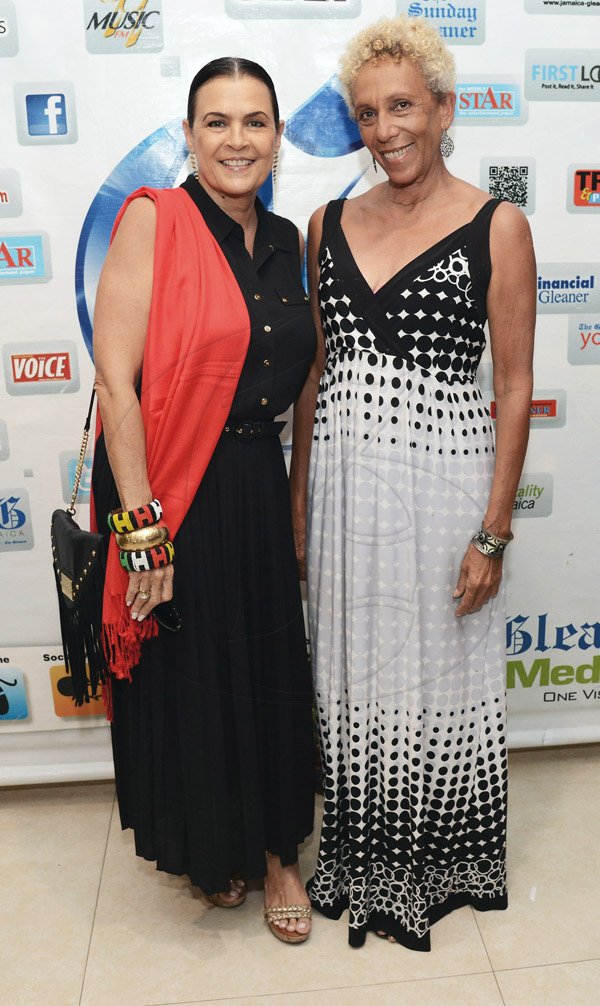 Rudolph Brown/ Photographer<\n>The ever graceful Cindy Breakspeare and her lovely chaperone Inansi at The Gleaner's Honour awards.<\n>
