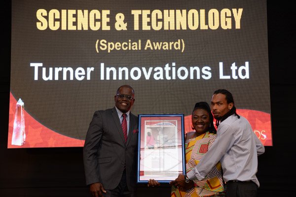 Jermaine Barnaby/Photographer
Allison Turner and her husband Oral Turner accepting their award at the Gleaner Honour awards held at the Pegasus hotel on Monday January 25, 2016.