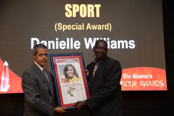 Jermaine Barnaby/Photographer
Desmond Williams  accepting of behalf of his daughter  Gleaner Honour awards held at the Pegasus hotel on Monday January 25, 2016.