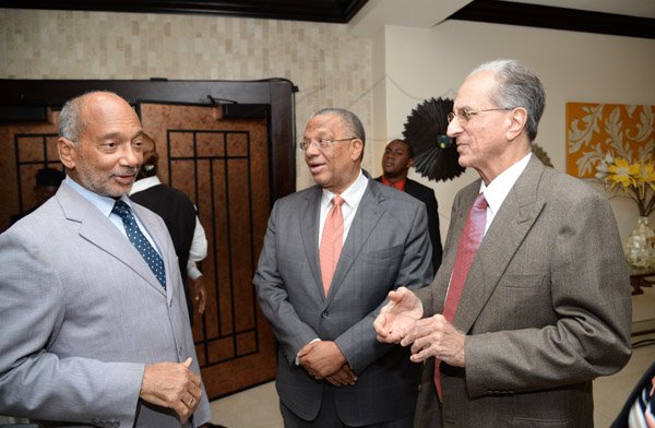 Jermaine Barnaby/Photographer
Douglas Oraine (left) having a conversation with Dr. Peter Phillips (center) and John Issa at the Gleaner Honour awards held at the Pegasus hotel on Monday January 25, 2016.