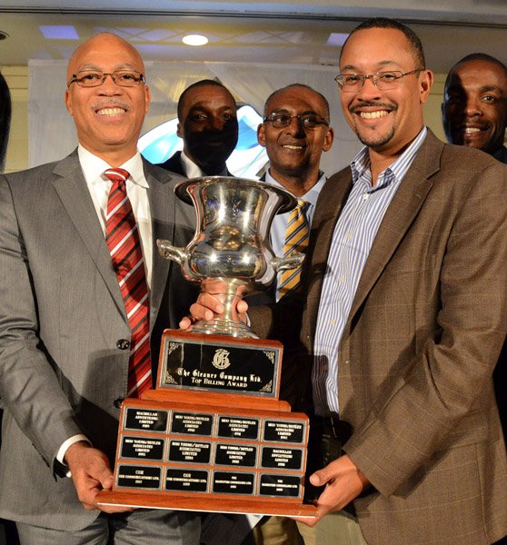 Rudolph Brown/Photographer
Christopher Barnes (right) Managing Director of the Jamaica Gleaner presents the Top Billing award to Oral McCook, (left) CEO of OGM Integrated Communications and Everton Patterson, (centre) COO of OGM at the Gleaner advertisers appreciation and agency awards luncheion held at the Wyndham Hotel in New Kingston on Tuesday, February 19, 2013