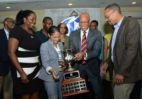 Rudolph Brown/Photographer

Oral McCook (right), chief executive officer of OGM Integrated Communications and his clients, including Cordia Panton-Williams (left), brand manager Best Dress Chicken and Tina Matalon (centre), director of marketing at Restaurants of Jamaica, celebrate the agency winning the top honour at The Gleaner Annual Advertisers Appreciation and Agency Awards Luncheon at the Wyndham Kingston Hotel yesterday.
