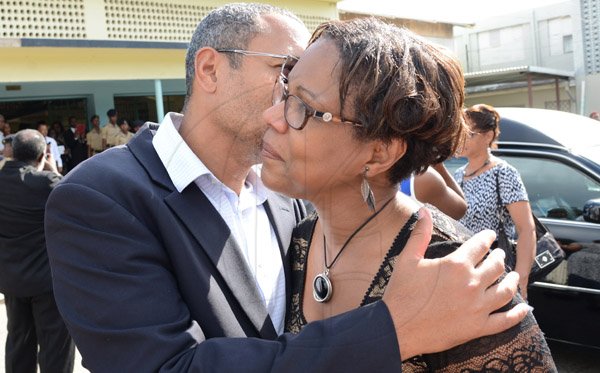 Rudolph Brown/Photographer
Christopher Barnes, managing director of the Gleaner greets Marcia Archer-Groves sister of Rev Glen Archer atfter the Thanksgiving service for the life Rev Glen Archer at the Ardenne High School Auditorium in Kingston on Sunday, March 1, 2015