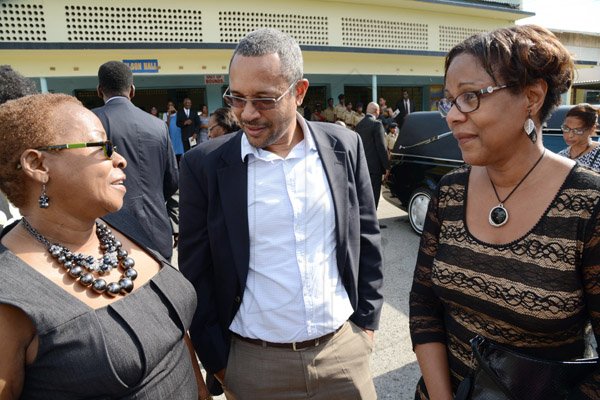Rudolph Brown/Photographer
Christopher Barnes, managing director of the Gleaner and Karen Cooper greets Marcia Archer-Groves, (right) sister of Rev Glen Archer after the Thanksgiving service for the life Rev Glen Archer at the Ardenne High School Auditorium in Kingston on Sunday, March 1, 2015