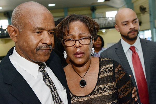 Rudolph Brown/Photographer
Fredrick Boyd, (left) cousin, Marcia Archer-Groves, sister and Jerome Archer, nephew at the Thanksgiving service for the life Rev Glen Archer at the Ardenne High School Auditorium in Kingston on Sunday, March 1, 2015