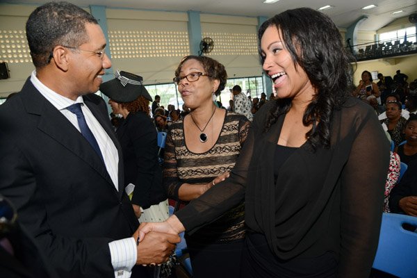 Rudolph Brown/Photographer
Andrew Holness, Opposition Leader greets Marcia Archer-Groves, (centre) and Giselle Groves at the Thanksgiving service for the life Rev Glen Archer at the Ardenne High School Auditorium in Kingston on Sunday, March 1, 2015