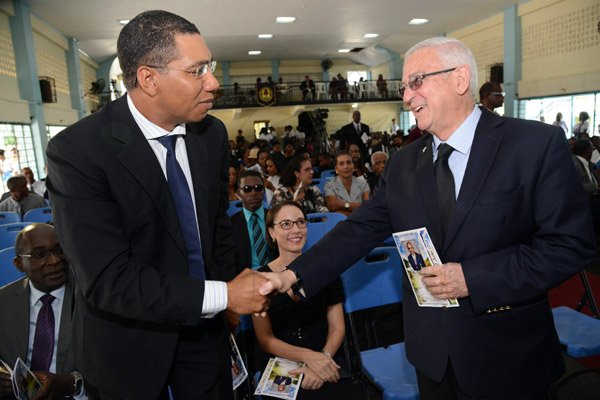 Rudolph Brown/Photographer
Ronald Thwaites left, Minister of Education greets Andrew Holness, Opposition Leader at the Thanksgiving service for the life Rev Glen Archer at the Ardenne High School Auditorium in Kingston on Sunday, March 1, 2015