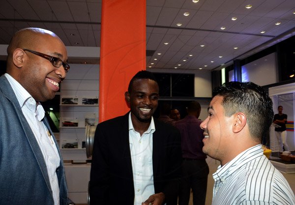 Winston Sill/Freelance Photographer
BUSINESS DESK:-----ATL Automotive launch of the Endless Summer of Tiguan, VW SUV's, held at the VW Showroom, Oxford Road, New Kingston on Thursday night August 21, 2014. Here are Delano Seiveright (left); Dr. Andre Haughton (centre), Lecturer, Department of Economics, UWI; and Matthew Samuda (right).