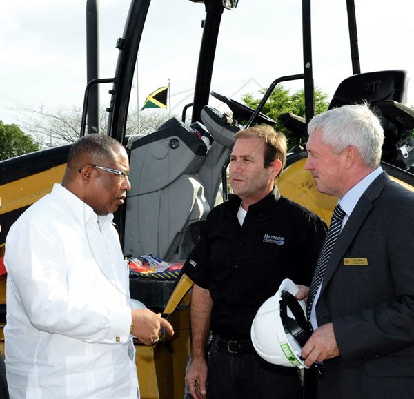 Winston Sill/Freelance Photographer
BUSINESS DESK:----- Toyota Jamaica host Ground Breaking Ceremony for the construction of a  New Branch, held at Old Hope Road, St. Andrew on Wednesday January 28, 2015. Here are  Anthony Hylton (left), Minister of Industry, Investment and Commerce;  Peter Matalon (centre); and Tom Connor (right), Managing Director, Toyota Jamaica Limited.