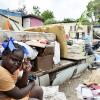 Rudolph Brown/Photographer
Mackyla Clarke sits with her belongings at the side of her house in Christian Penn, St Catherine. The house was destroyed during the passage of Hurricane Sandy on Wednesday.