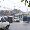 Motorists along Main Street, Ocho Rios, Tuesday afternoon as heavy rains pelted the resort town