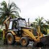 Anthony Minott/Freelance Photographer
A tractor removes debris from a road in Greater Portmore after the passage of Hurricane Sandy in Portmore, St Catherine last Thursday.