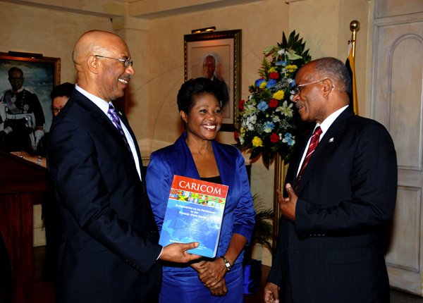 Winston Sill / Freelance Photographer
The University College of the Caribbean (UCC) function  to launch the UCC Foundation and launch of Sir Kenneth Hall's Book, held at King's House on Tuesday April 17, 2012. Here are Governor General Sir Patrick Allen (left); Lady Patricia Allen (centre); and Sir Kenneth Hall (right).