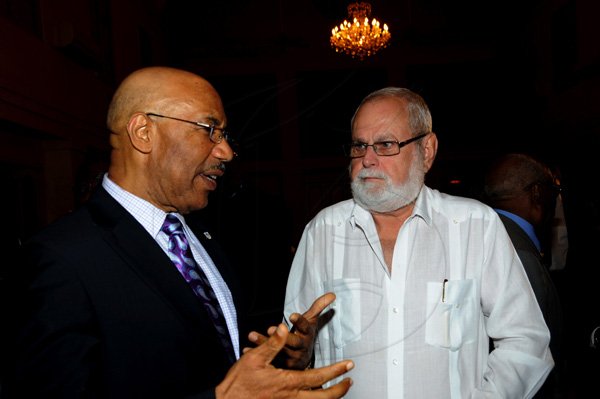 Winston Sill / Freelance Photographer
The University College of the Caribbean (UCC) function  to launch the UCC Foundation and launch of Sir Kenneth Hall's Book, held at King's House on Tuesday April 17, 2012. Here are Governor General Sit Patrick Allen (left); and Joseph A. Matalon (right).