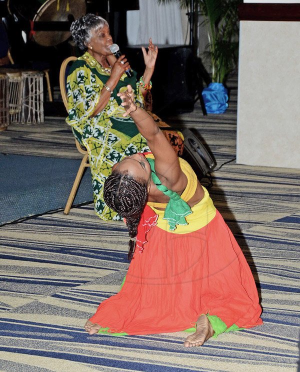 Winston Sill/Freelance Photographer
Thandie Klaasen delivers a soulful rendition of Bob Marley's No Woman No Cry as a female dancer from the L'Acadco Dance Company performs the acompanying dance piece at last Sunday's Unite In Songs for Charity event at the Jamaica Pegasus Hotel.