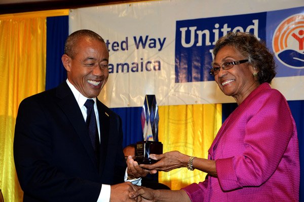Winston Sill/Freelance Photographer
United Way of Jamaica annual Nation Builders'  Awards and  Employee Awards Ceremony, Held at the Jamaica Pegasus Hotel, New Kingston on Thursday September 11, 2014. Here are Dr. Robert Chen (left); and Lady Rheima Hall (right).