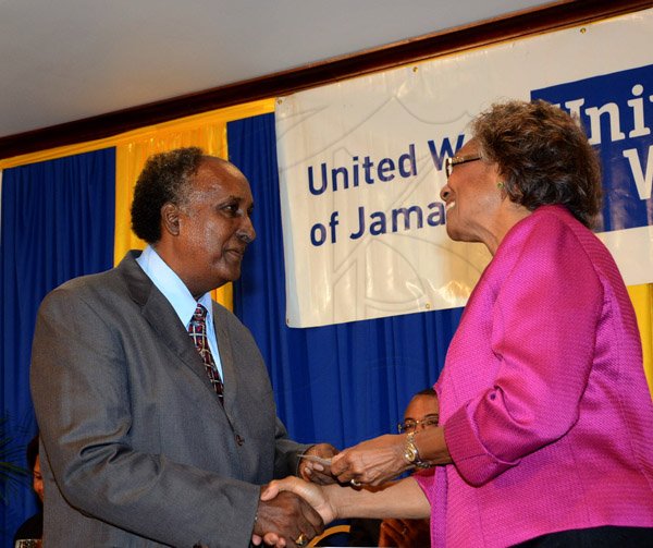 Winston Sill/Freelance Photographer
United Way of Jamaica annual Nation Builders'  Awards and  Employee Awards Ceremony, Held at the Jamaica Pegasus Hotel, New Kingston on Thursday September 11, 2014. Here are Carlton Stephen (left); and Lady Rheima Hall (right).