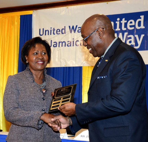 Winston Sill/Freelance Photographer
United Way of Jamaica annual Nation Builders'  Awards and  Employee Awards Ceremony, Held at the Jamaica Pegasus Hotel, New Kingston on Thursday September 11, 2014. Here are Claudette Christie (left), of Jamaica Co-operative Credit Union League; and Ian Forbes (right), Chairman, United Way of Jamaica.