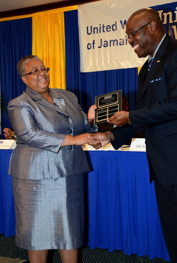 Winston Sill/Freelance Photographer
United Way of Jamaica annual Nation Builders'  Awards and  Employee Awards Ceremony, Held at the Jamaica Pegasus Hotel, New Kingston on Thursday September 11, 2014. Here are Marlene Street-Forrest??? (left), of the Jamaica Stock Exchange; and Ian Forbes (right), Chairman, United Way of Jamaica.