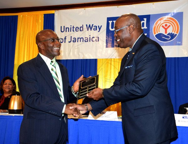 Winston Sill/Freelance Photographer
United Way of Jamaica annual Nation Builders'  Awards and  Employee Awards Ceremony, Held at the Jamaica Pegasus Hotel, New Kingston on Thursday September 11, 2014. Here are Nathan Thompson (left), Manager, Personnel and Industrial Relations, Noranda Bauxite Limited; and Ian Forbes (right), Chairman, United Way of Jamaica.